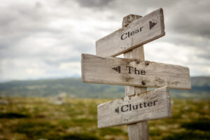 Sign post that says, Clear the Clutter