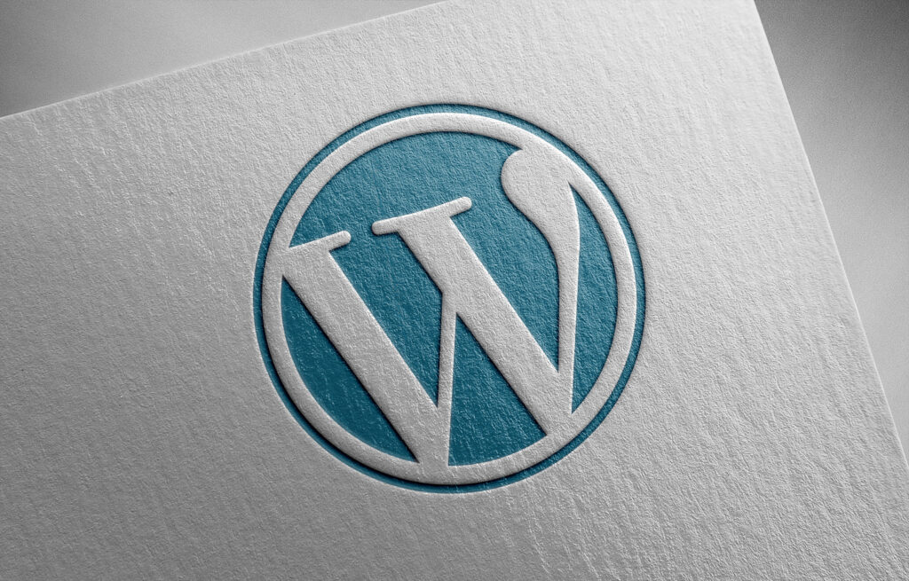 WordPress Logo pressed into fine paper